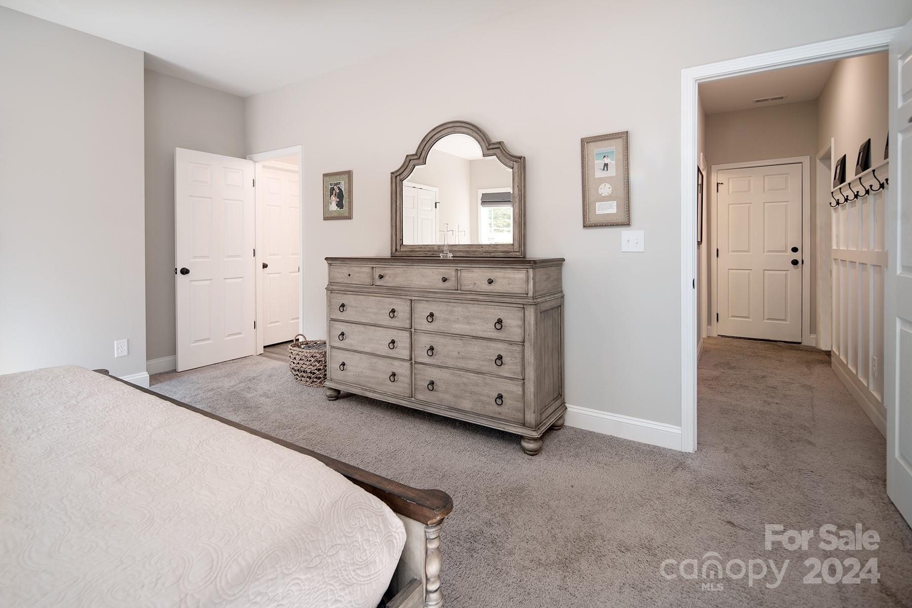 3000 Penninger Road Concord, NC 28025 - Photo 31 of 48 a spacious bedroom with a bed and a dresser
