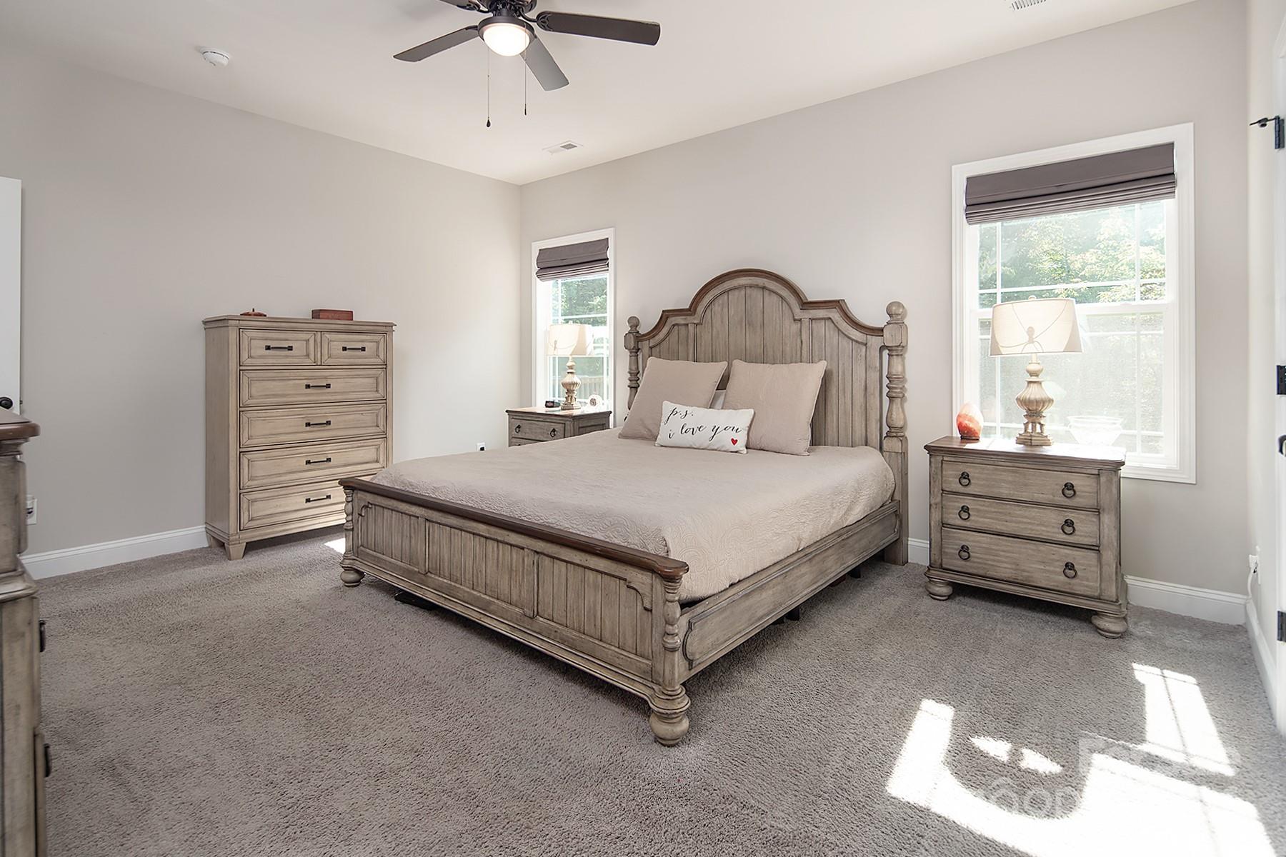 3000 Penninger Road Concord, NC 28025 - Photo 32 of 48 a bedroom with a bed and a chandelier