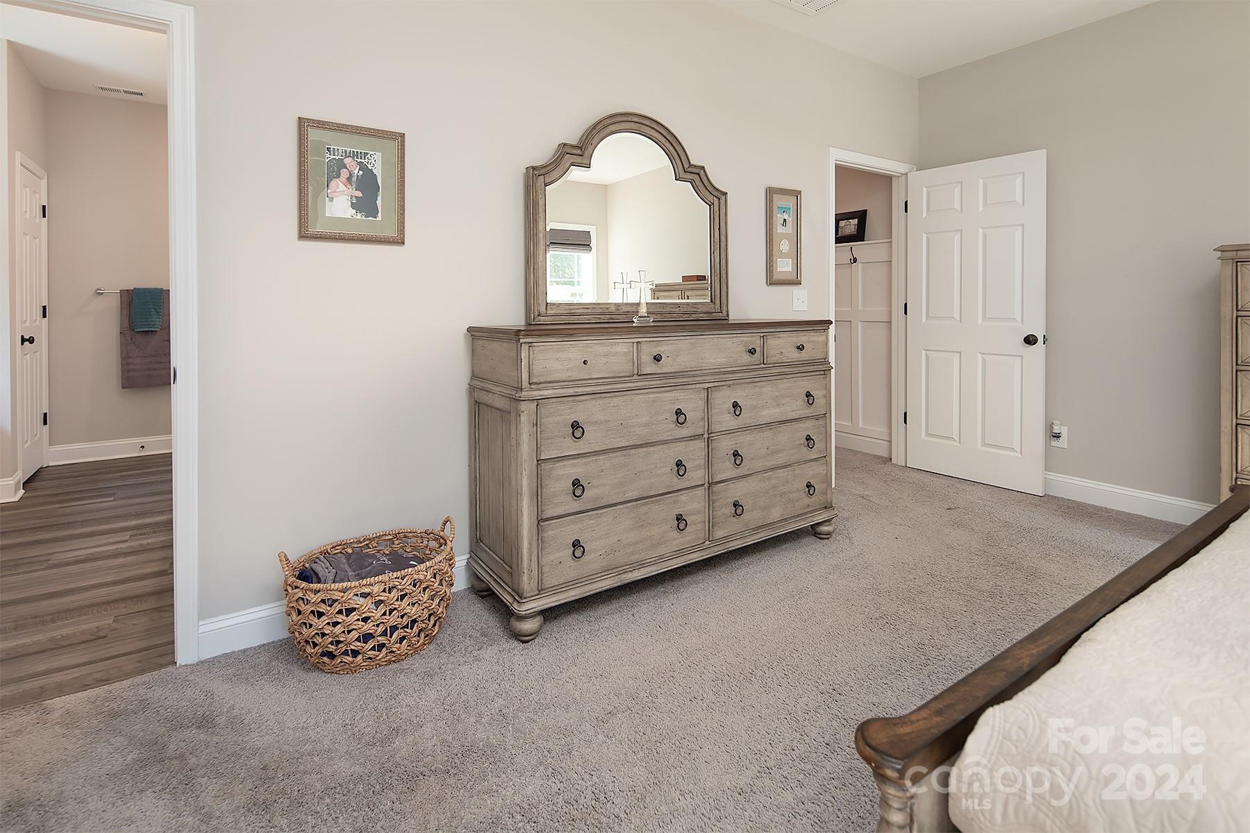 3000 Penninger Road Concord, NC 28025 - Photo 33 of 48 a room with a mirror and cabinets