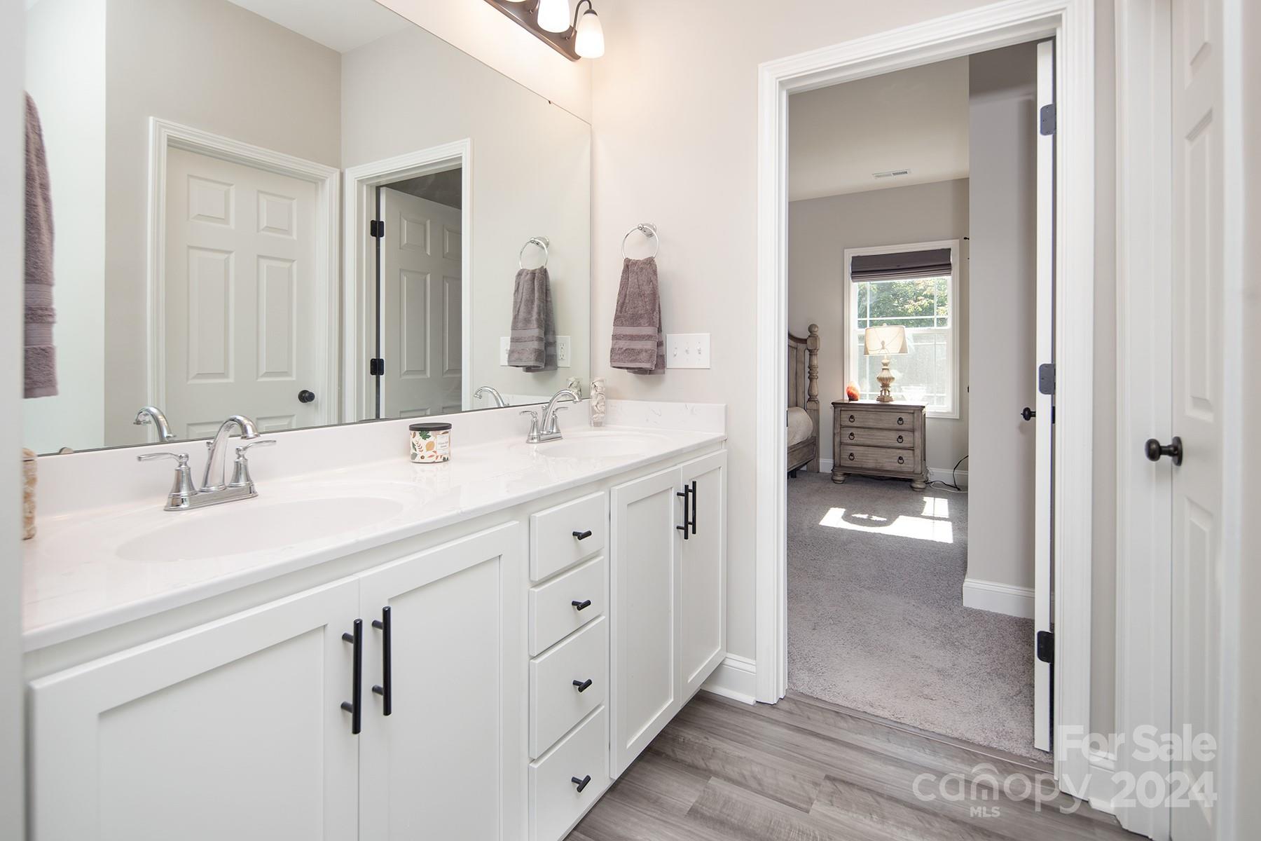 3000 Penninger Road Concord, NC 28025 - Photo 35 of 48 a spacious bathroom with a double vanity sink mirror and shower