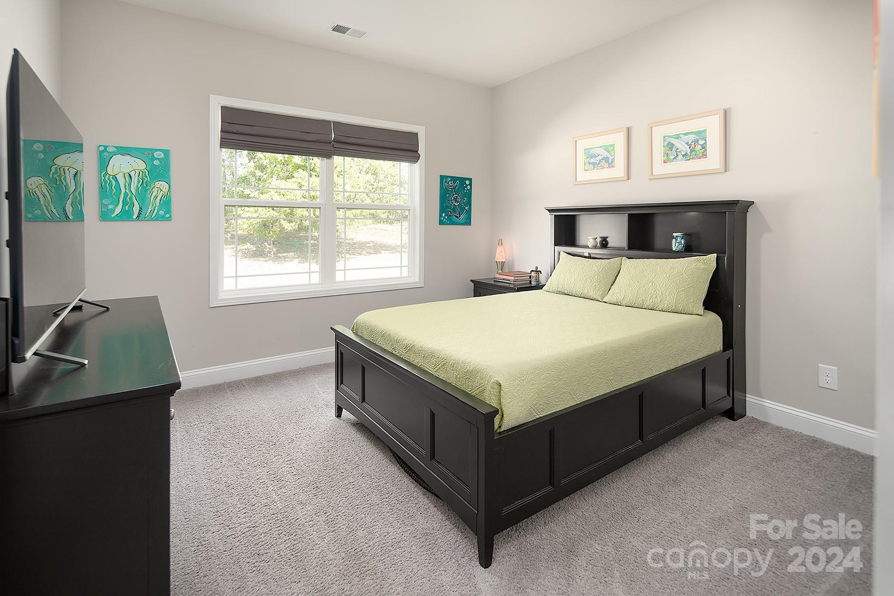 3000 Penninger Road Concord, NC 28025 - Photo 36 of 48 a large bed sitting in a bedroom next to a window