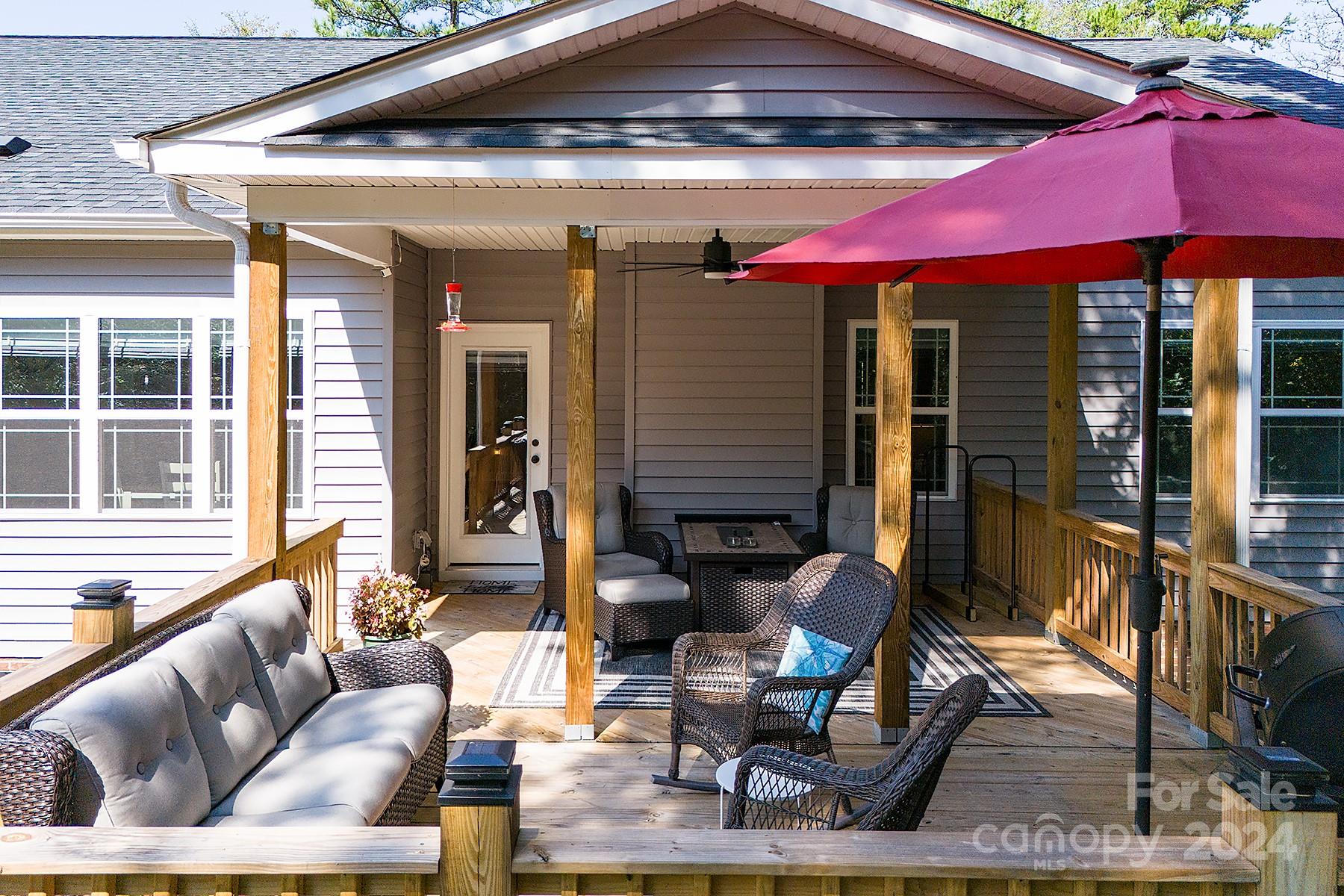 3000 Penninger Road Concord, NC 28025 - Photo 39 of 48 a outdoor living area with furniture and a umbrella