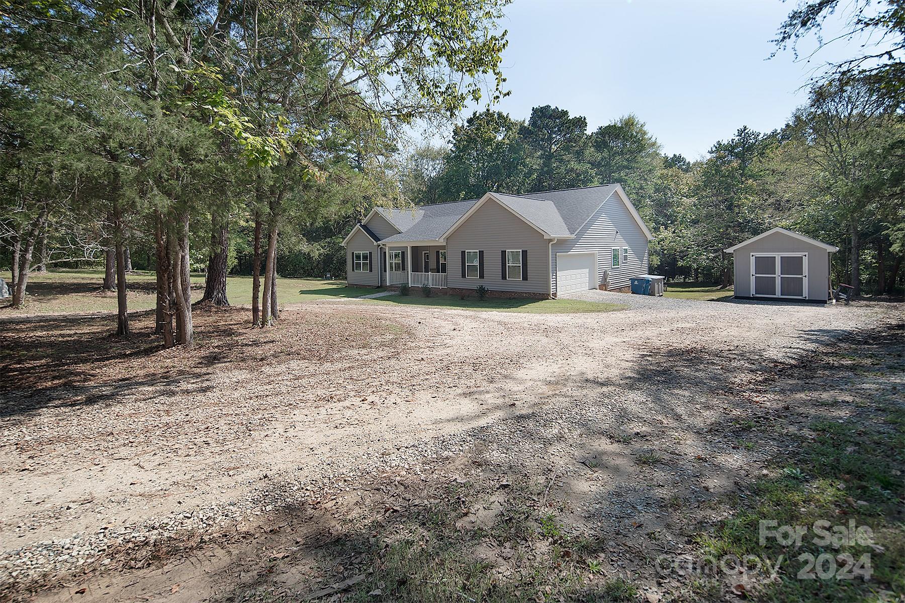 3000 Penninger Road Concord, NC 28025 - Photo 6 of 48 a front view of a house with a yard