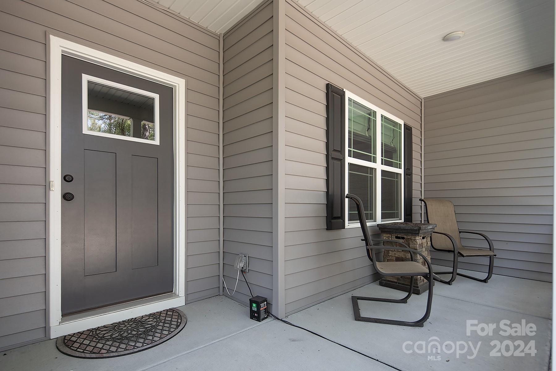 3000 Penninger Road Concord, NC 28025 - Photo 8 of 48 a view of a door with a chair and a barbeque