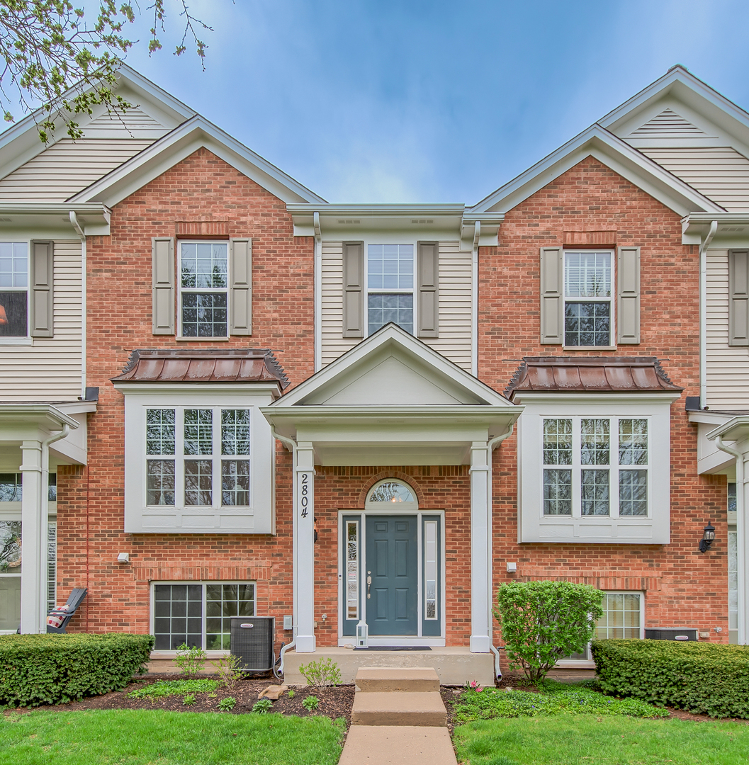 2804 Neubauer Circle Lindenhurst, IL 60046 - Photo 1 of 26 front view of a brick house with a yard