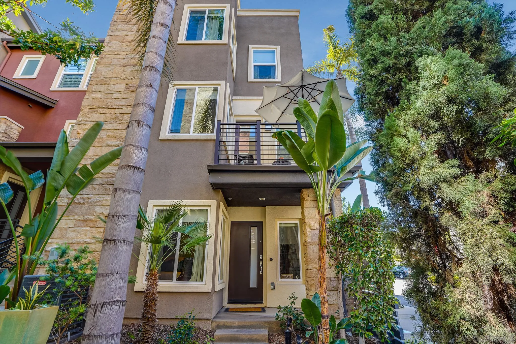 a front view of a house with garden