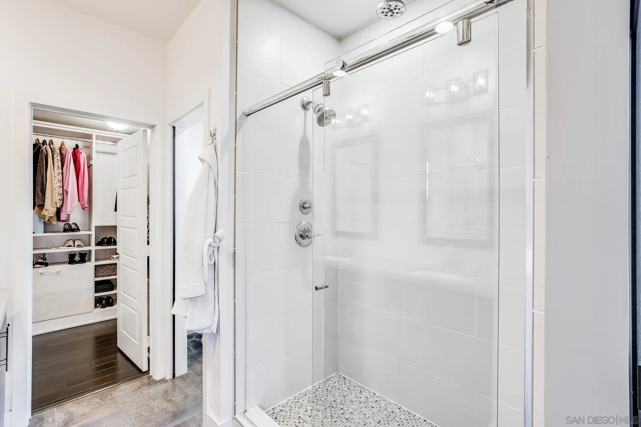 7803 Inception Way San Diego, CA 92108 - Photo 22 of 37 a bathroom with a shower and a sink