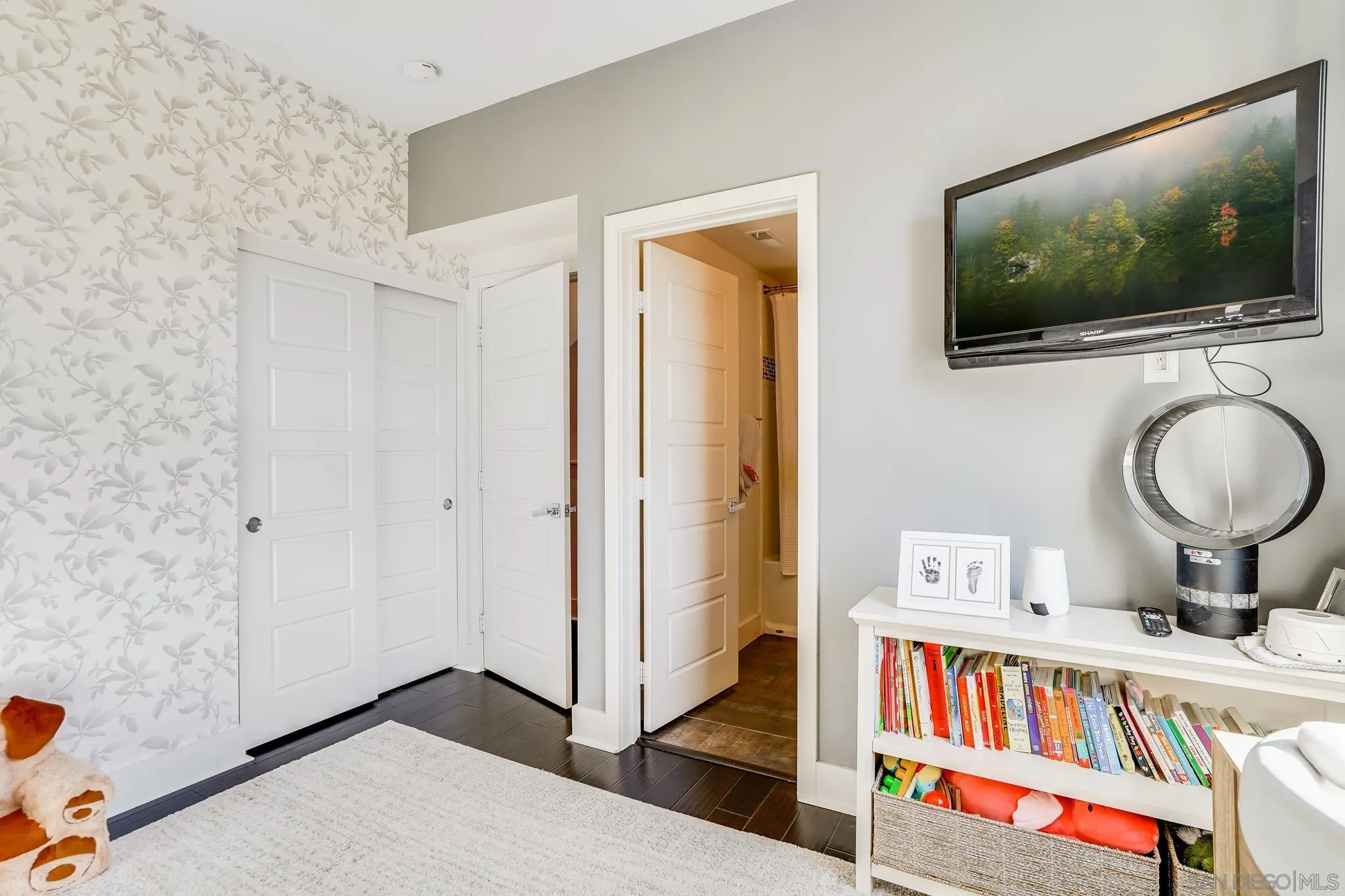 7803 Inception Way San Diego, CA 92108 - Photo 25 of 37 a bedroom with a bed and a flat screen tv