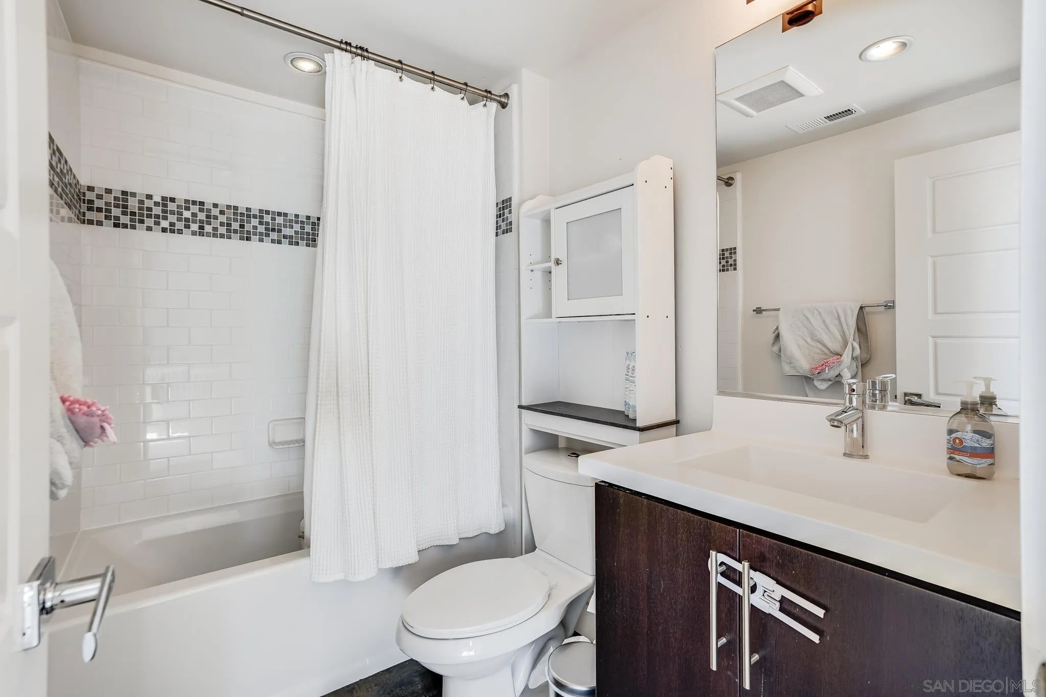 7803 Inception Way San Diego, CA 92108 - Photo 26 of 37 a bathroom with a sink a toilet and shower