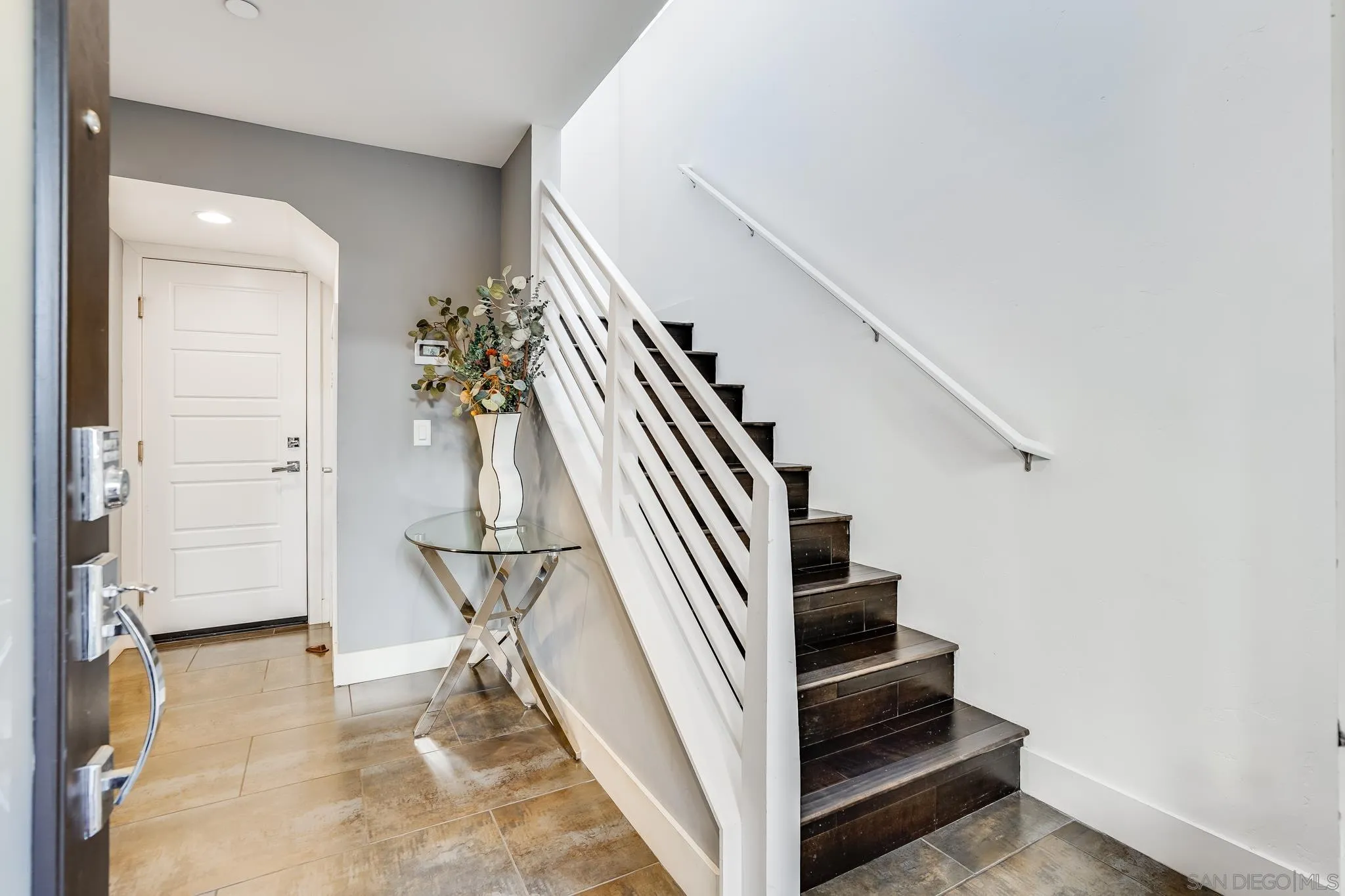 7803 Inception Way San Diego, CA 92108 - Photo 5 of 37 a view of entryway and hall with wooden floor