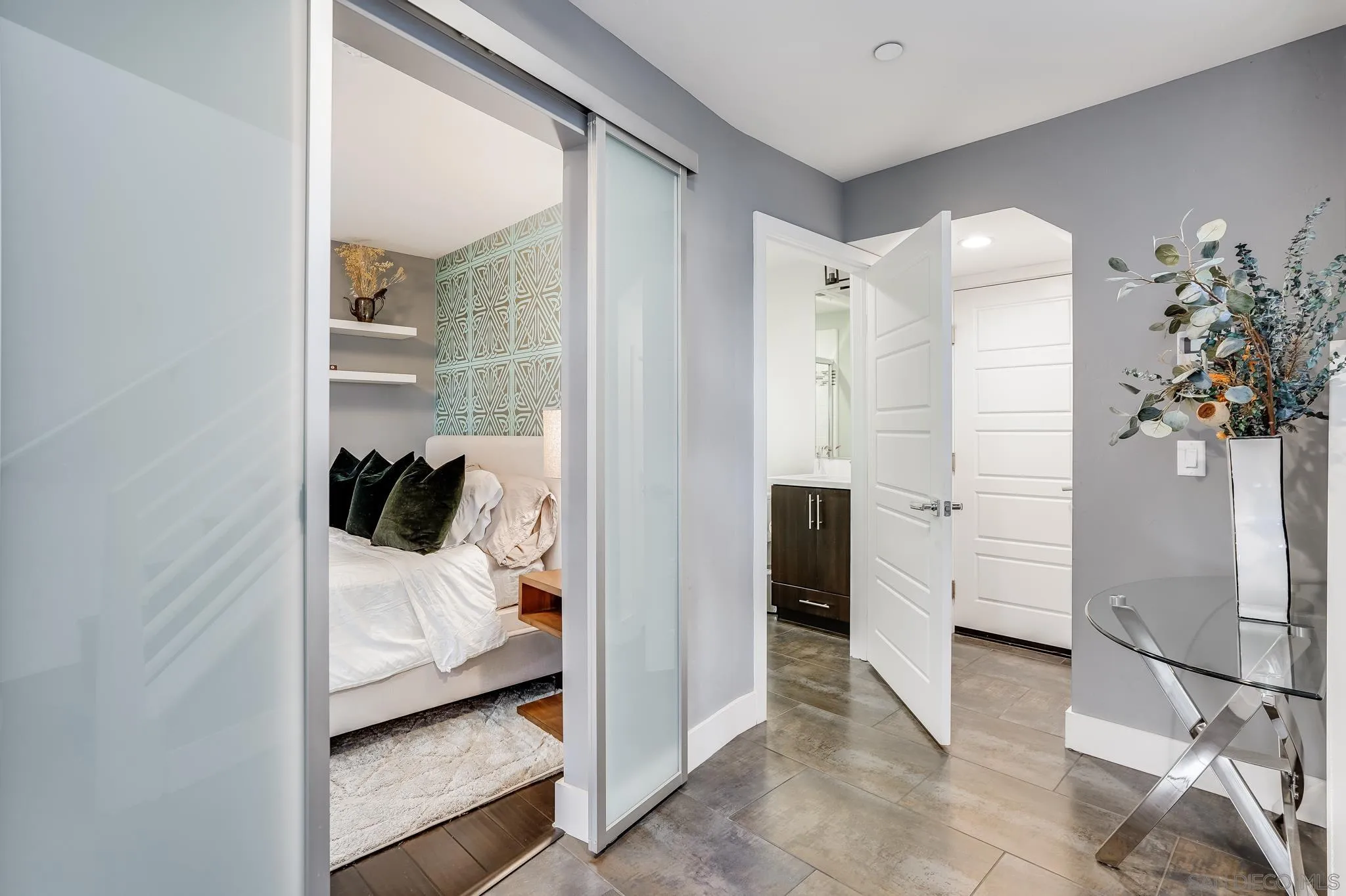 7803 Inception Way San Diego, CA 92108 - Photo 6 of 37 a bedroom with a bed and a potted plant