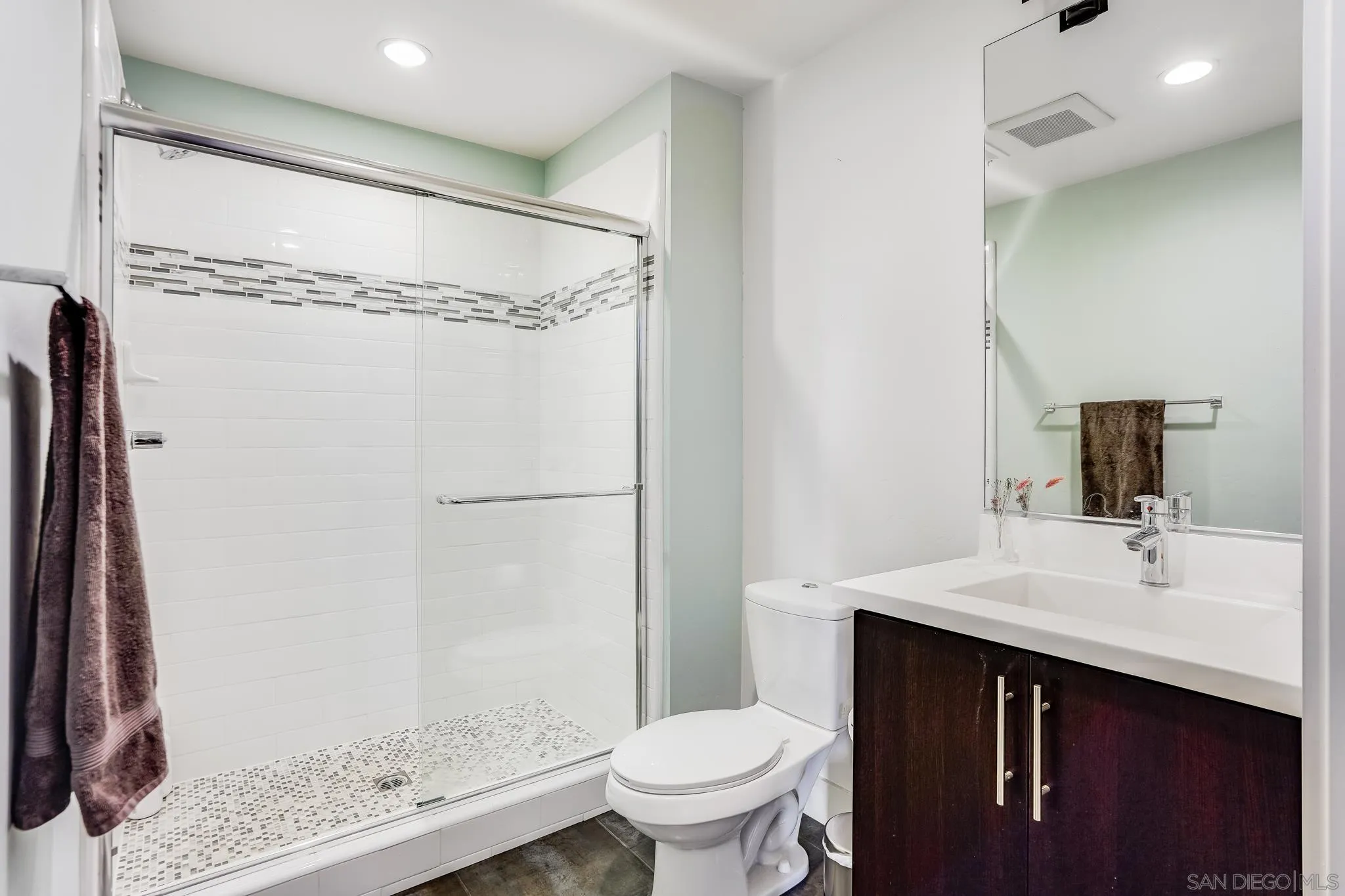 7803 Inception Way San Diego, CA 92108 - Photo 8 of 37 a bathroom with a sink a toilet and shower