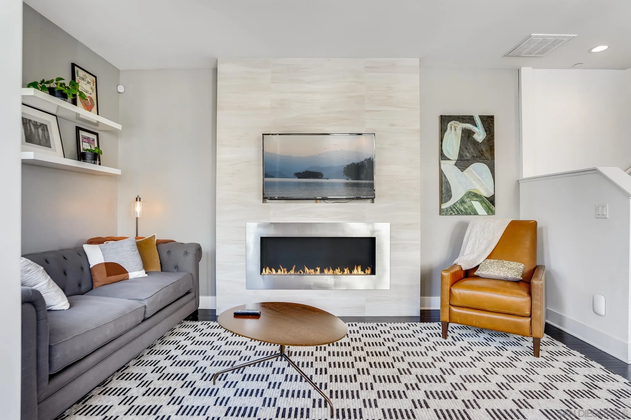 7803 Inception Way San Diego, CA 92108 - Photo 10 of 37 a living room with furniture and a fireplace