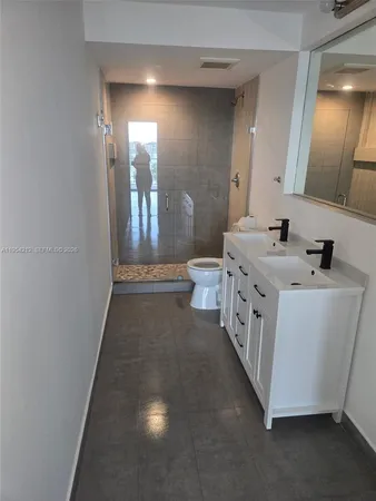 a stove top oven sitting inside of a kitchen