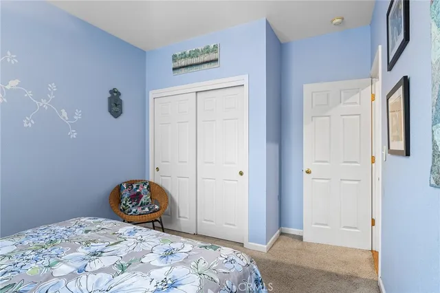 a bedroom with a bed and a cabinets