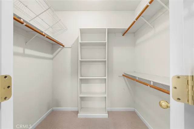 a view of an empty walk in closet