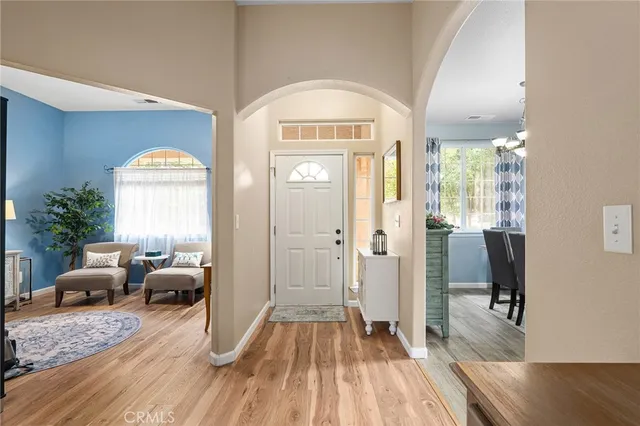 a bedroom with furniture and a large window