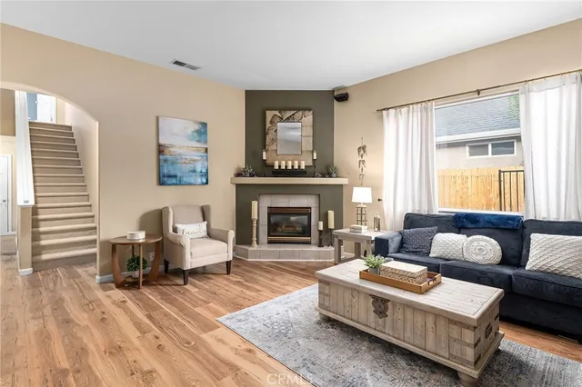 a living room with furniture and a fireplace