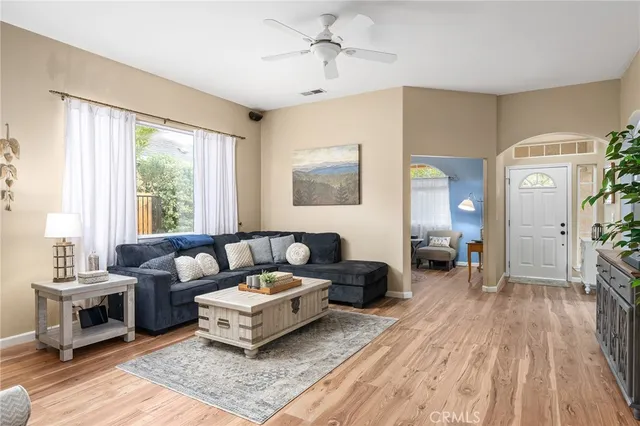 a living room with furniture and a large window