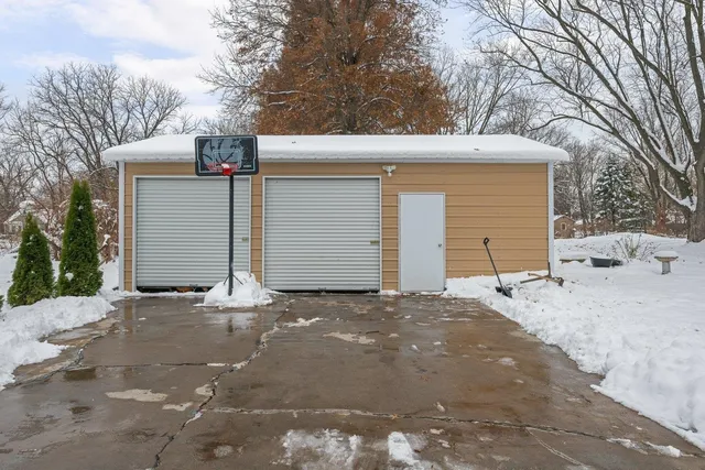 a view of a house with a yard and garage