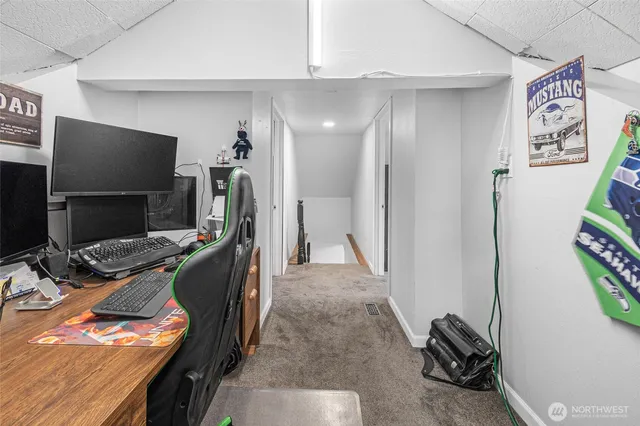 a view of a livingroom with furniture and a flat screen tv