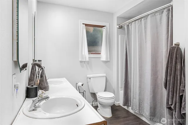 a view of a livingroom with furniture and a flat screen tv