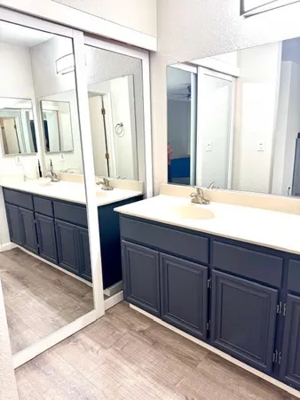 a bedroom with a bed and a fireplace