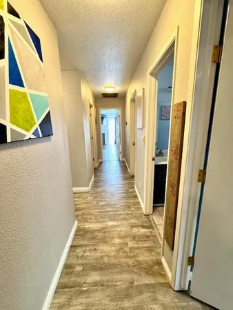 a living room with a bed furniture and a window