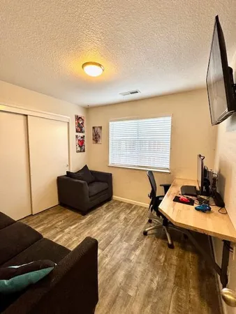 a bedroom with bed and window