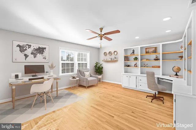 a view of empty room with ceiling fan