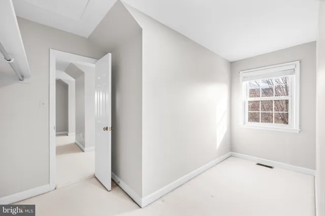 a view of a house with a small yard and plants