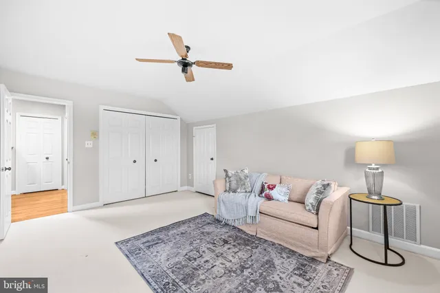 a view of a park with iron fence