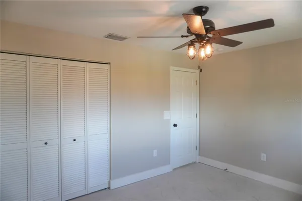a view of a chandelier fan in a room