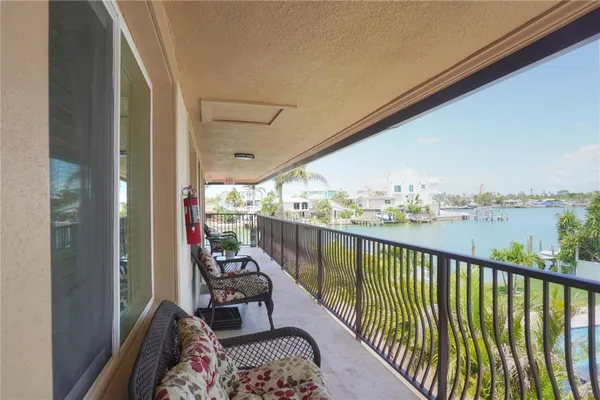 a view of balcony with furniture