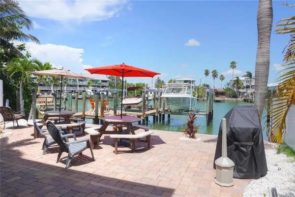 a view of a patio with chairs and tables
