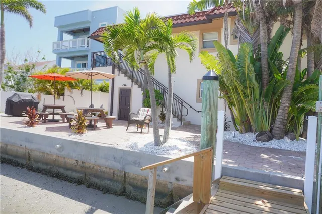 a view of a palm tree with an outdoor seating
