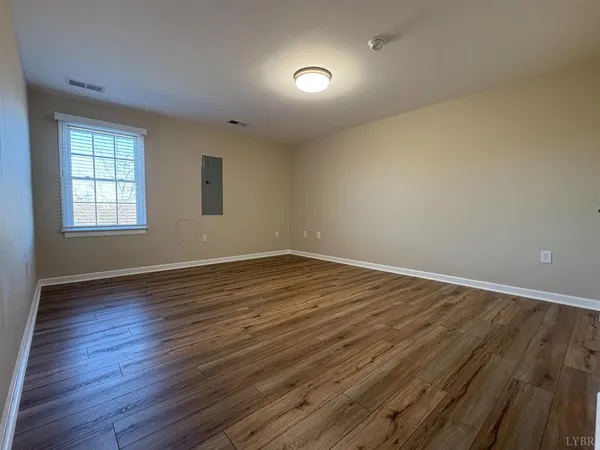 a view of empty room with stairs