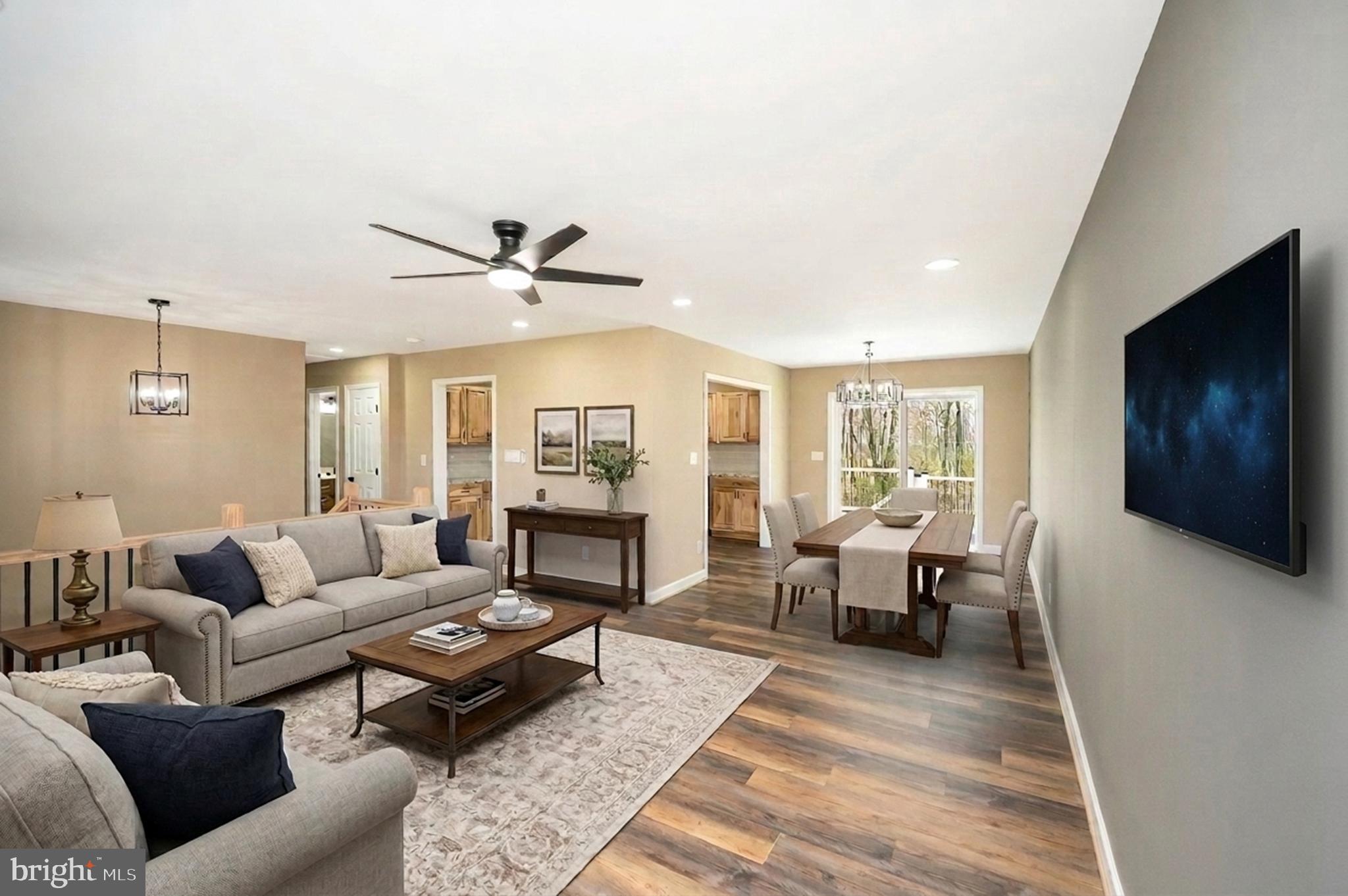 13452 Post Oak Road Spotsylvania, VA 22551 - Photo 18 of 56 a living room with furniture and a flat screen tv