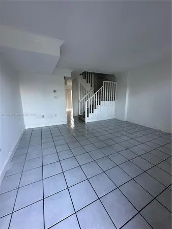 a view of an empty room and entryway