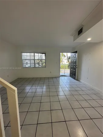 a view of an empty room and window