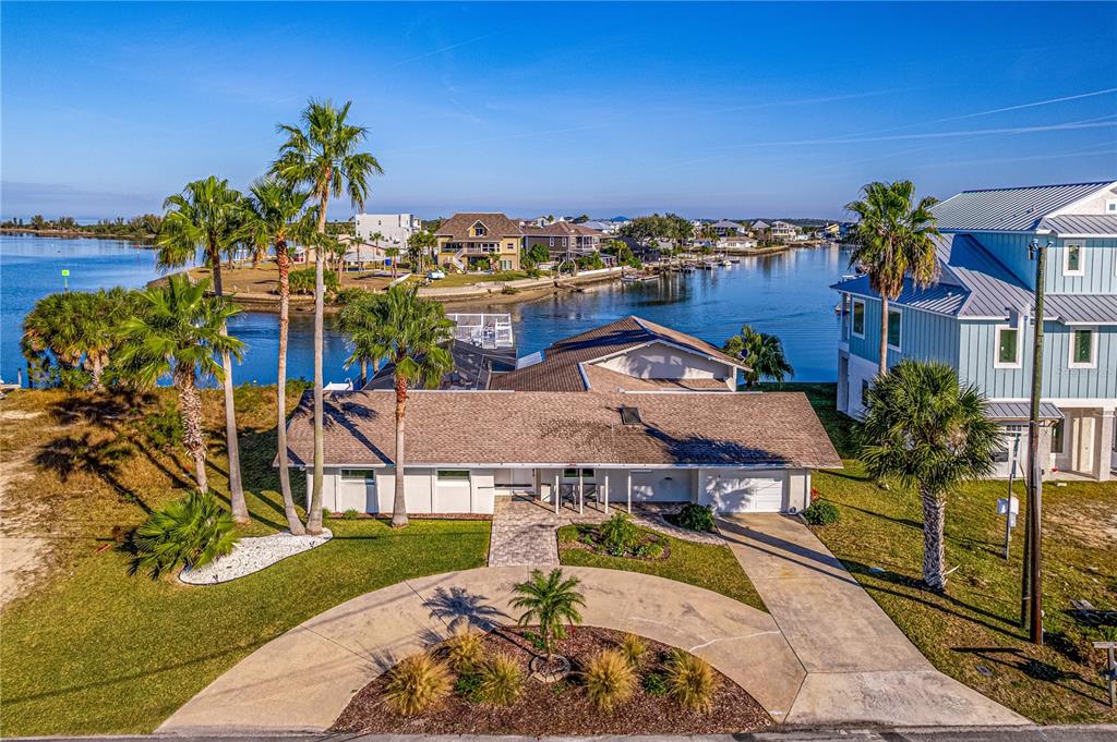 3409 Gulf Winds Circle Hernando Beach, FL 34607 - Photo 1 of 84 an aerial view of a house with a swimming pool and outdoor seating