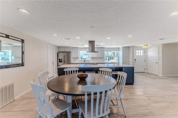 a kitchen with a sink cabinets and window