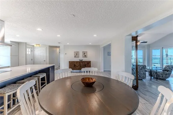 a kitchen with a sink a window and stainless steel appliances