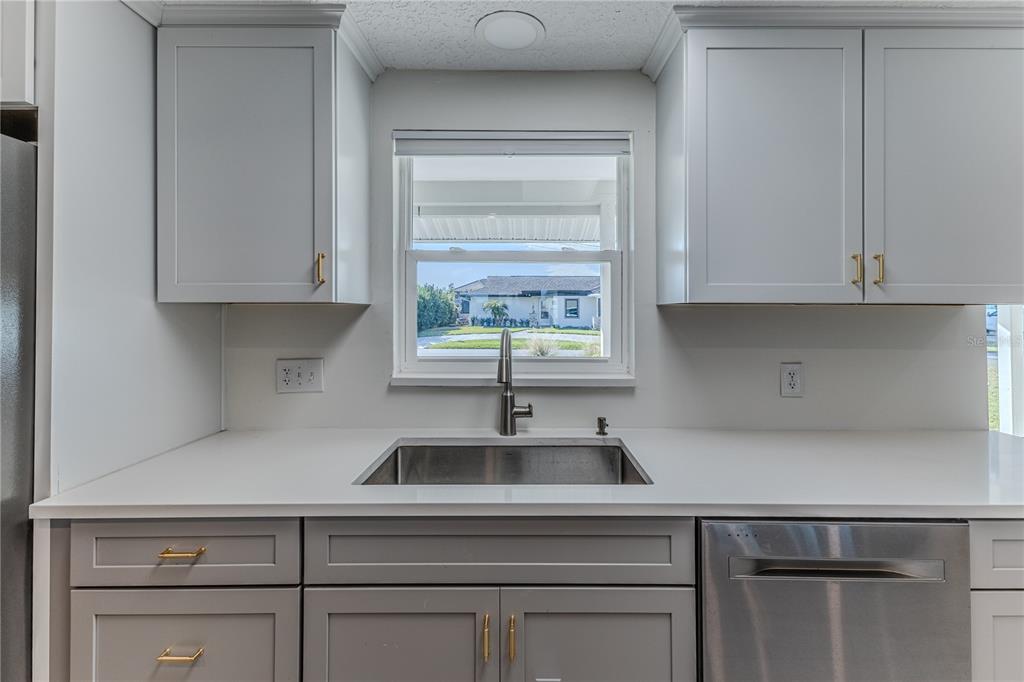 3409 Gulf Winds Circle Hernando Beach, FL 34607 - Photo 18 of 84 a kitchen with a sink cabinets and window