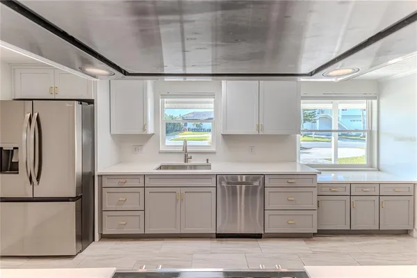 a living room with fireplace furniture and a chandelier