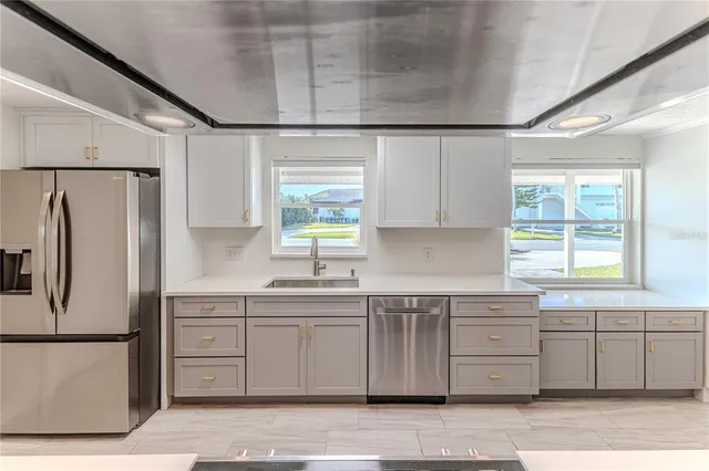 a living room with fireplace furniture and a chandelier