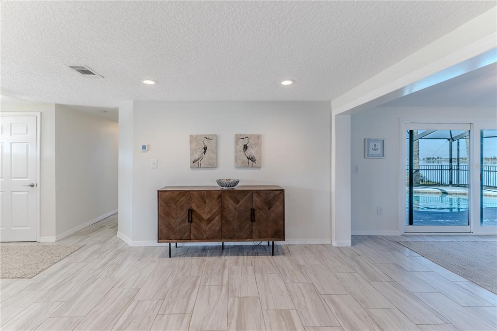 3409 Gulf Winds Circle Hernando Beach, FL 34607 - Photo 24 of 84 an empty room with wooden floor and windows