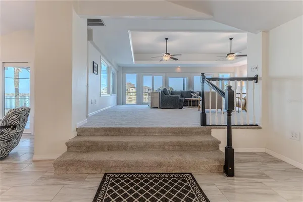 an aerial view of a house with a ocean view