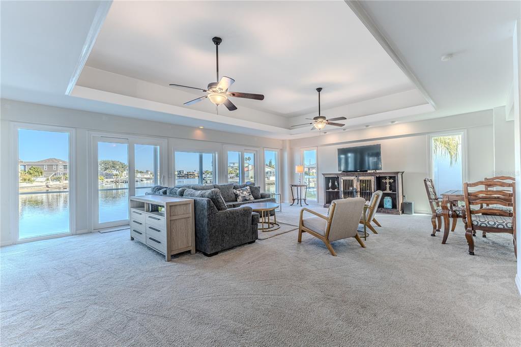 3409 Gulf Winds Circle Hernando Beach, FL 34607 - Photo 30 of 84 a living room with furniture and a chandelier