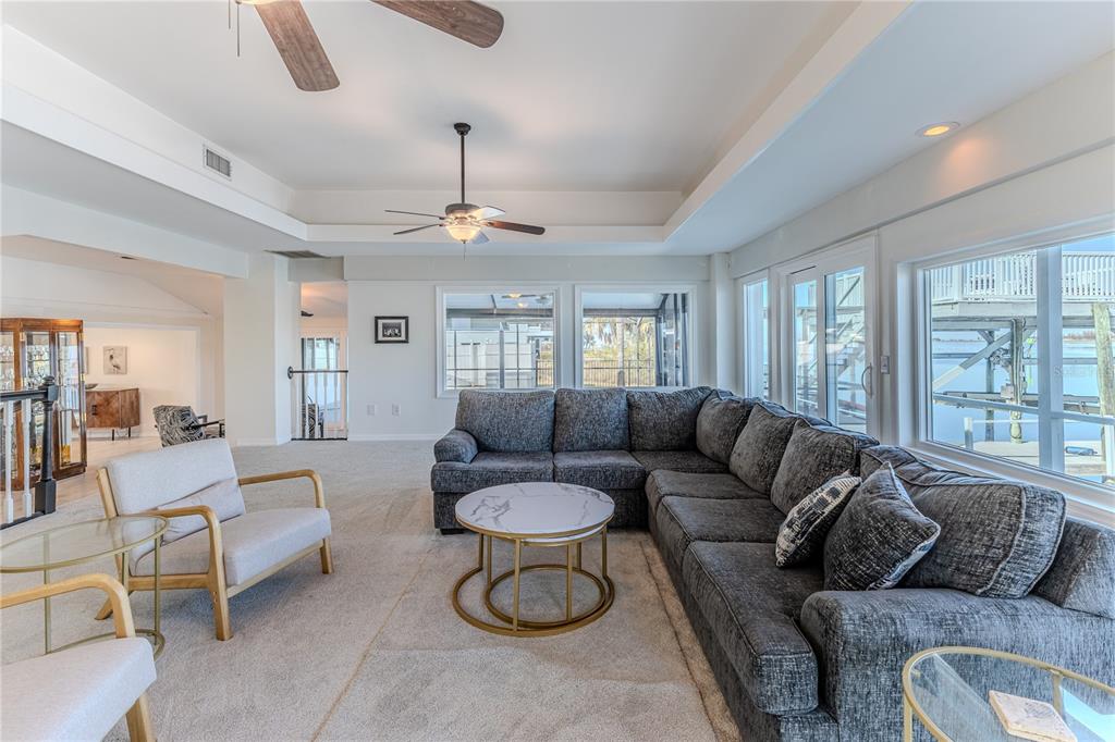 3409 Gulf Winds Circle Hernando Beach, FL 34607 - Photo 32 of 84 a living room with furniture and a large window